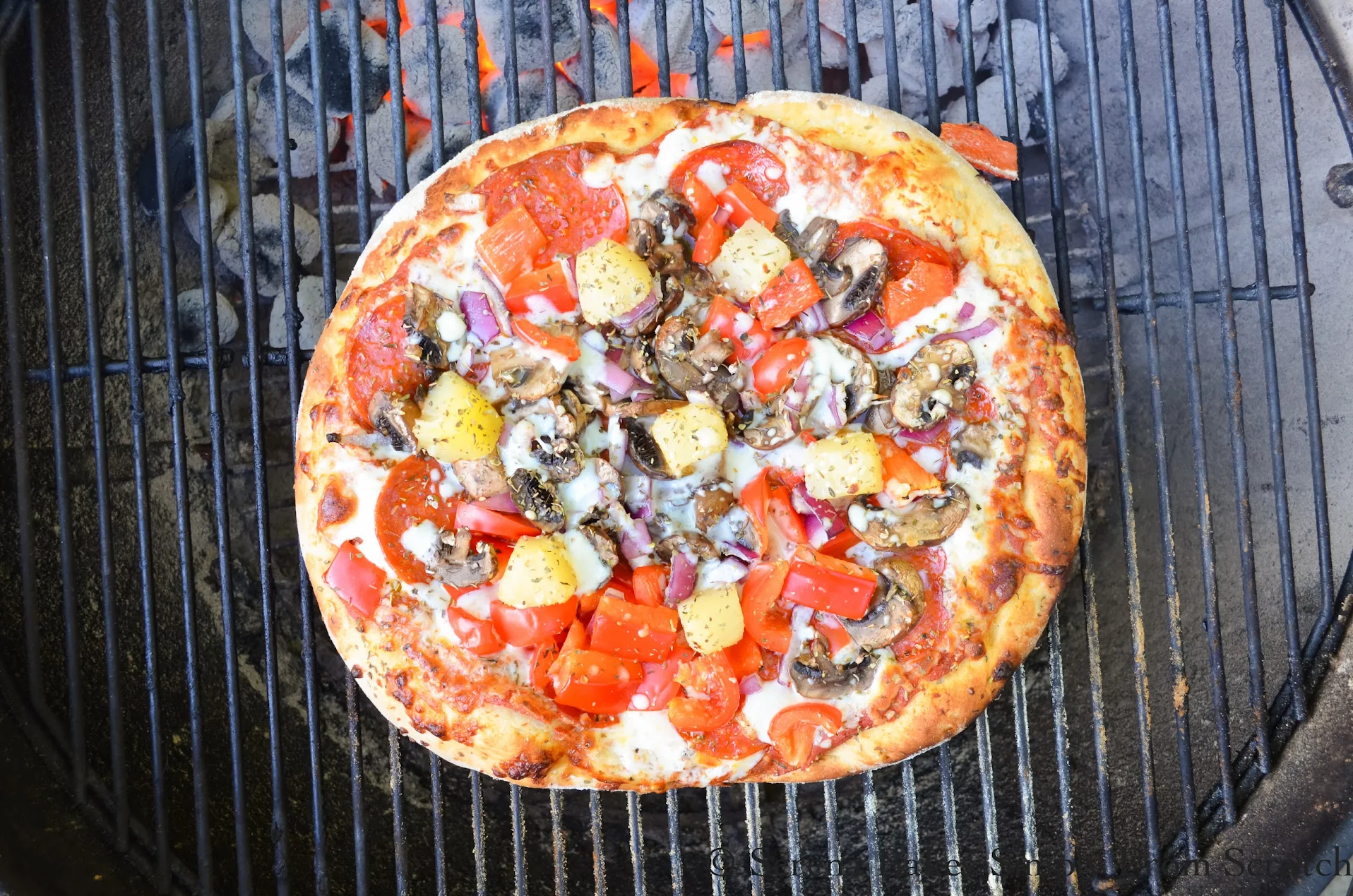 Charcoal top grill pizza